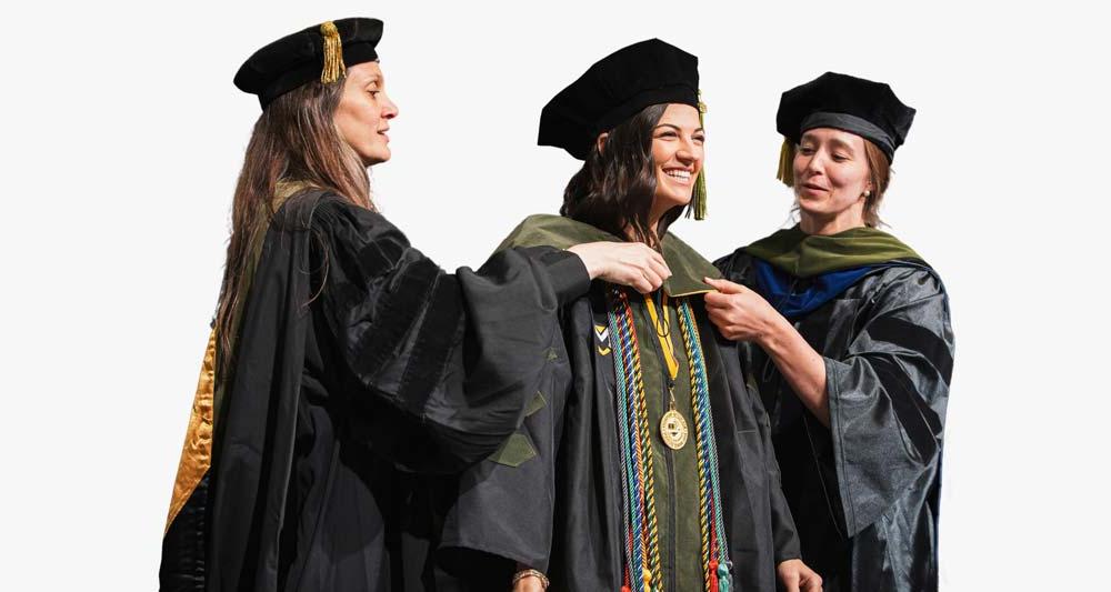 A student enjoys the MU Hooding Ceremony with the Pharmacy Program.